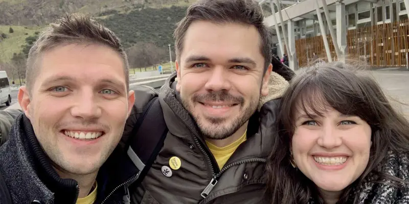 founders Colm, Darren and Lydia smiling to the camera