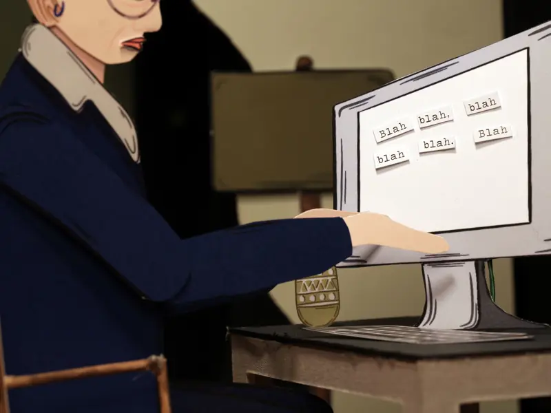 A close up of a reporter typing on a computer in a stop motion animation