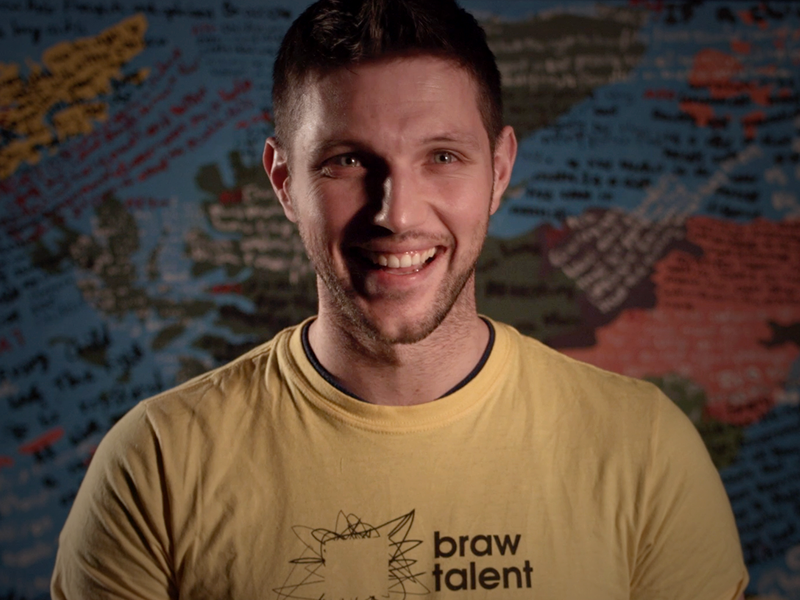 Colm smiling at the camera